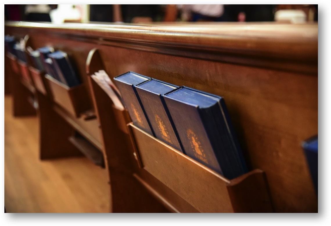 Pew with hymnals